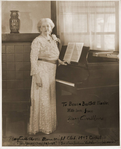 Autographed publicity portrait of Mary Carr Moore, standing