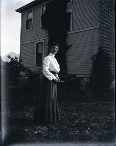 Woman outside house, Claremont