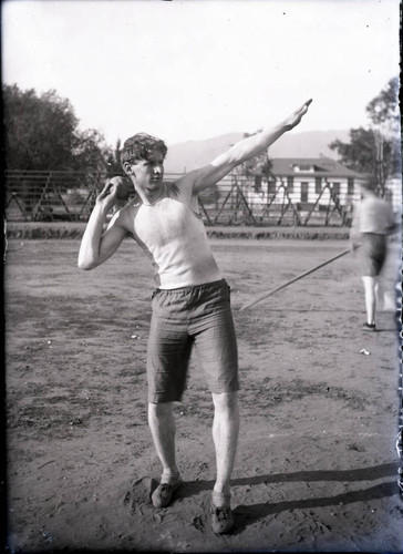 Track and field athlete putting shot