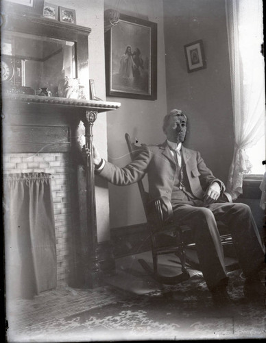 Unidentified man in rocking chair