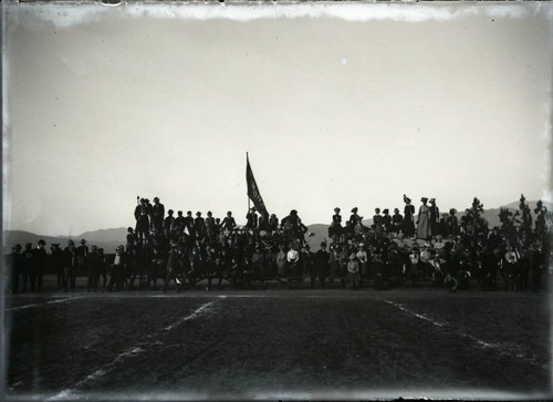 Spectators at a football game between USC and Pomona College