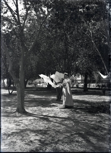 Mary Burleigh hanging out laundry