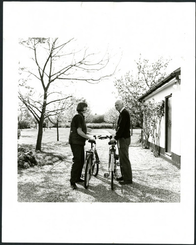 Charles and Elizabeth Handy, outdoor biking gray photo