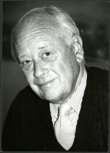 Charles Handy, grayscale photo indoors