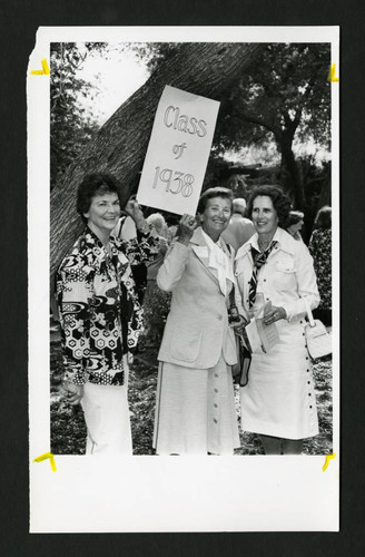 Scripps alumnae smiling together by a class of 1938 sign, Scripps College