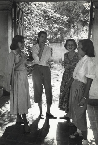 Scripps College students chatting in a courtyard