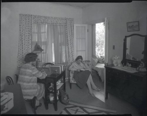 Two women studying in a dormitory room, Pomona College