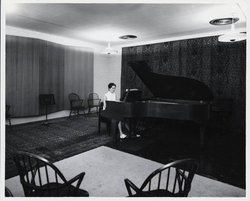 Woman plays piano, Scripps College