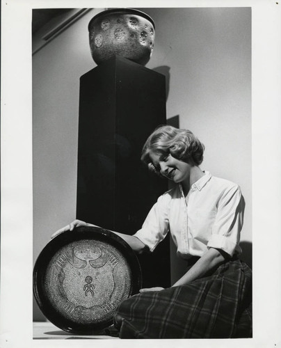 Woman with ceramic plate, Scripps College