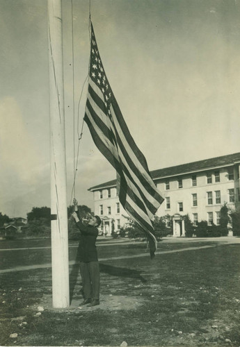 American flag raised in front of Smiley Hall Dormitory, Pomona College