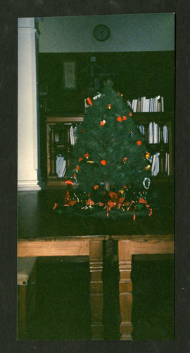 Christmas tree displayed on two tables in the Holbein Room of Denison Library, Scripps College