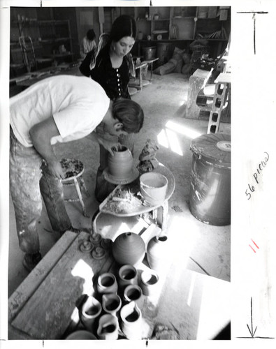 Man and woman with pottery wheel, Scripps College