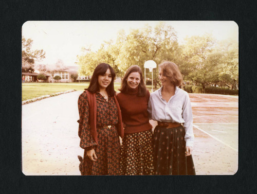 Three alumnae from the class of 1971 embrace at their eight year reunion, Scripps College