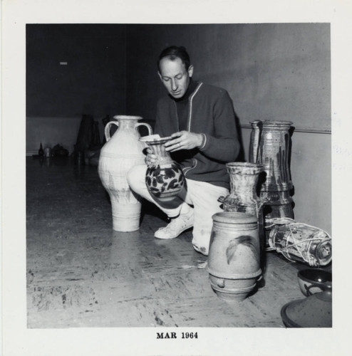 Professor with ceramic pieces, Scripps College