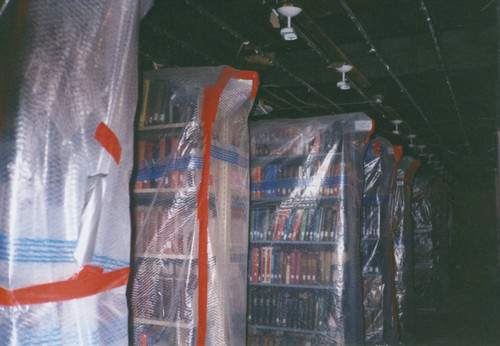 Books wrapped in plastic during renovation at Honnold/Mudd Library