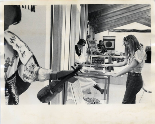 Woman observes in an art gallery, Scripps College