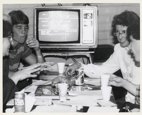 A group of students sit around a table, Claremont McKenna College