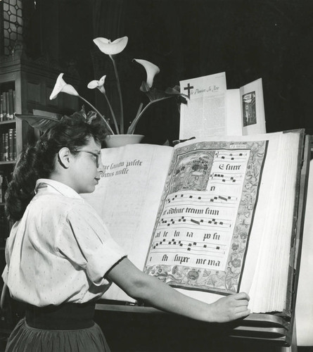 Student reading Gradual at Ella Strong Denison Library, Scripps College