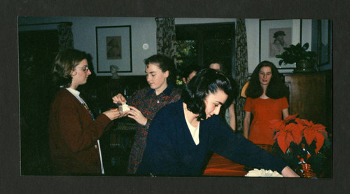 Scripps students mingling at Denison Library's 1995 Christmas party, Scripps College