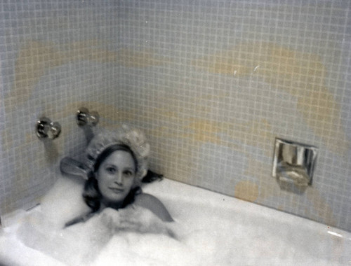 Student in bubble bath, Pitzer College