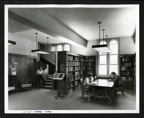 Three students reading in the new Drake Wing of Denison Library, Scripps College