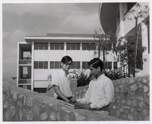 Two students standing against a wall, Claremont McKenna College