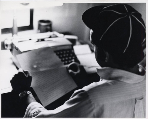 A student reading a piece of paper, Claremont McKenna College