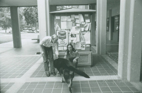 Students and dog outside McManus Hall