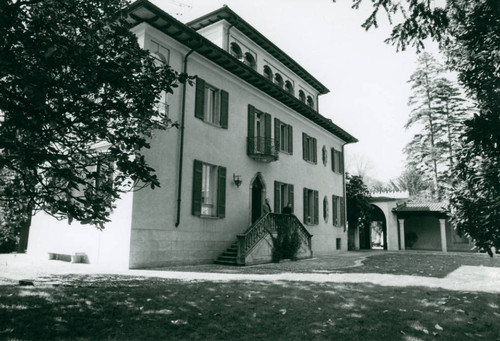 Two men standing outside the entrance of a building, Claremont McKenna College