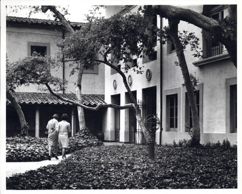 Two women walking in Sycamore Court, Scripps College