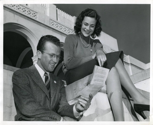 Man and woman reading a pamphlet, Pomona College