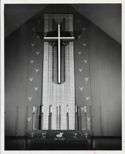 Weaving behind cross, Scripps College