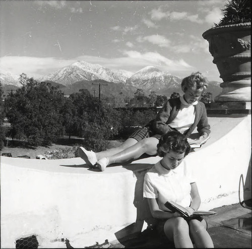 Students reading on patio of Browning Hall, Scripps College