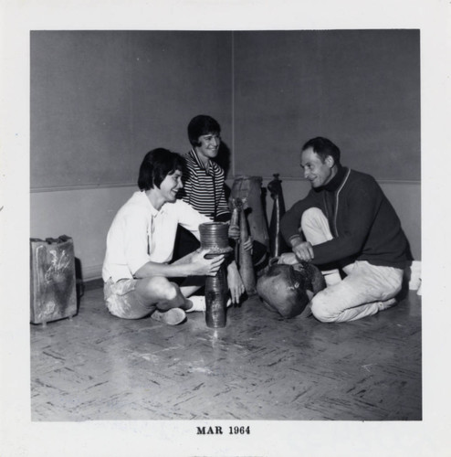 Professor with students and ceramic pieces, Scripps College