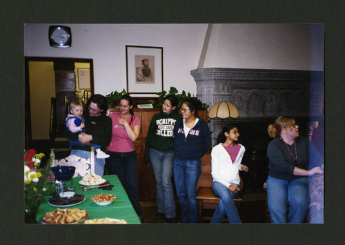 Denison Library staff eating together at the 2004 Staff Christmas Party, Scripps College