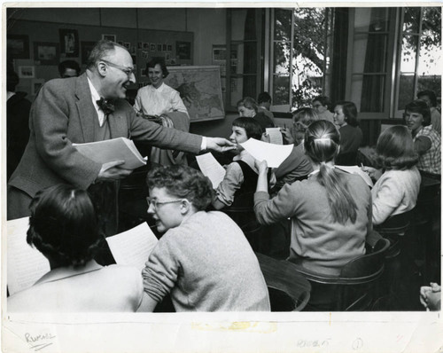 Dr. Merlan hands out a test, Scripps College