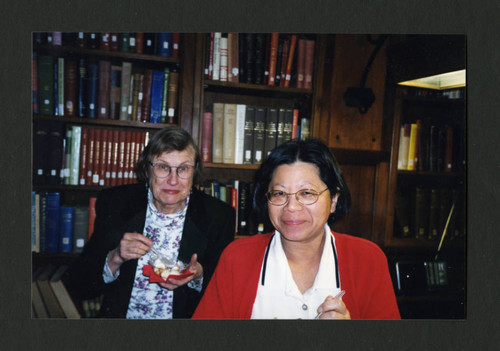 Two women eating desert together at Denison Library's 2000 Christmas tea, Scripps College