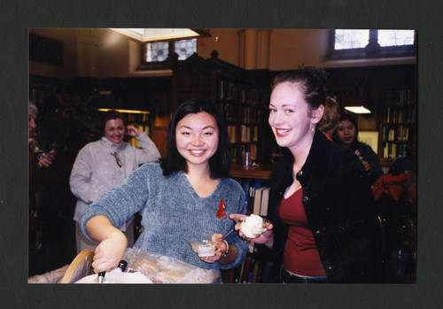 Scripps students eating ice cream at Denison Library's Christmas tea party, Scripps College