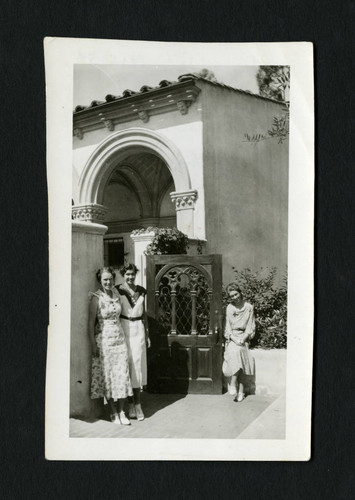 Denison Library Staff resting together outside the library gate, Scripps College