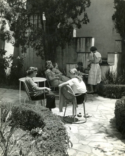 Relaxing in a courtyard, Scripps College