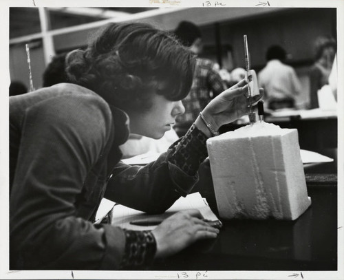 Woman in science lab, Scripps College