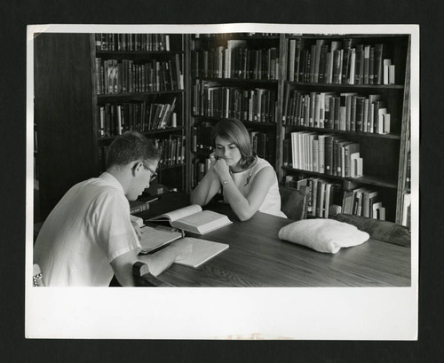 Two Claremont Colleges students studying in Denison Library, Scripps College