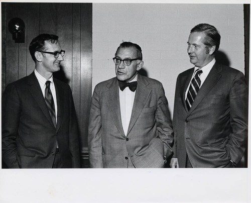 Jack Stark standing with two men, Claremont McKenna College