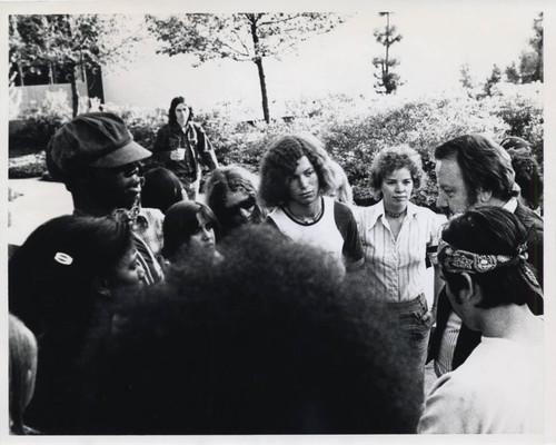 Jesse Unruh standing in a crowd, Claremont McKenna College