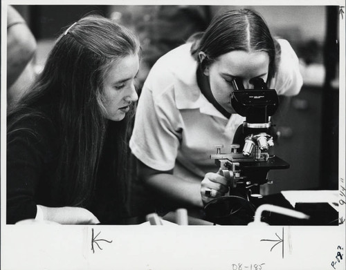 Women working with a microscope, Scripps College