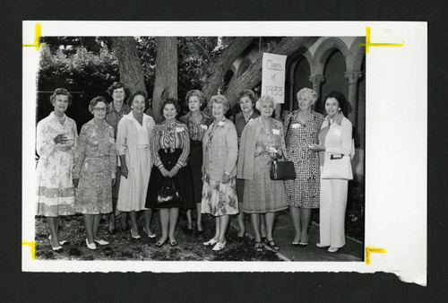 Scripps alumnae from the class of 1933 standing together in the Margaret Folwer garden, Scripps College