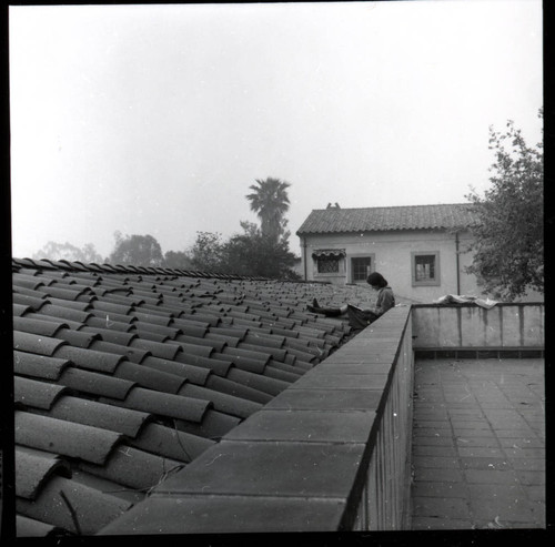 Student reading on roof of Balch Hall, Scripps College