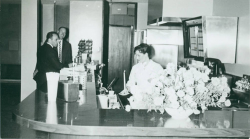 Cafeteria worker with candle, Harvey Mudd College