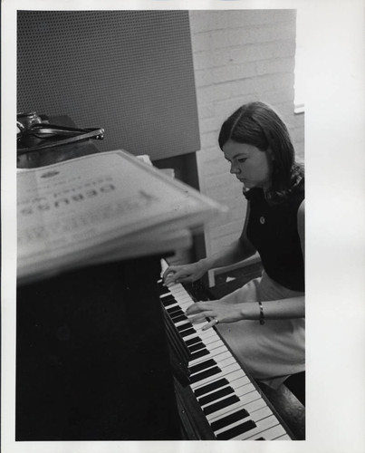 Woman plays piano, Scripps College