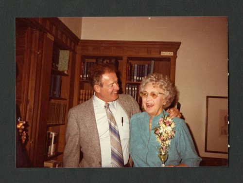 Ernie Jaqua and Dorothy Drake smiling during the presentation of Dorothy's portrait, Scripps College